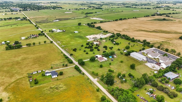 birds eye view of property with a rural view