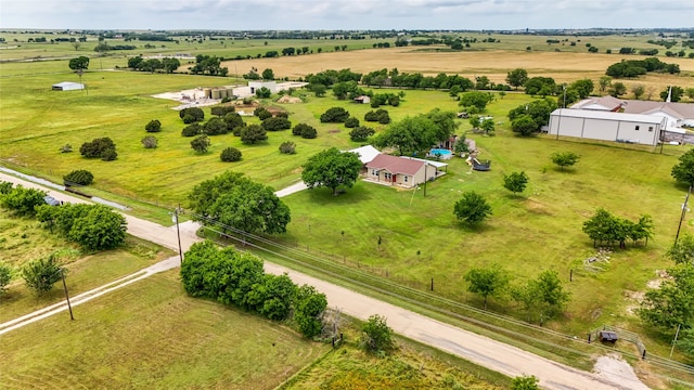 birds eye view of property with a rural view