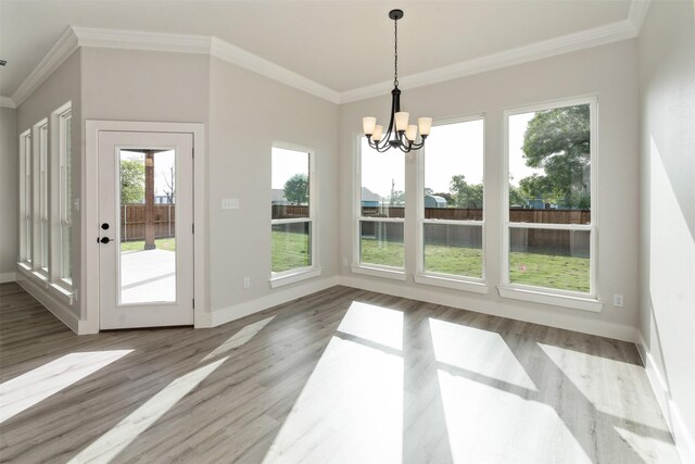 unfurnished dining area with plenty of natural light and wood-type flooring