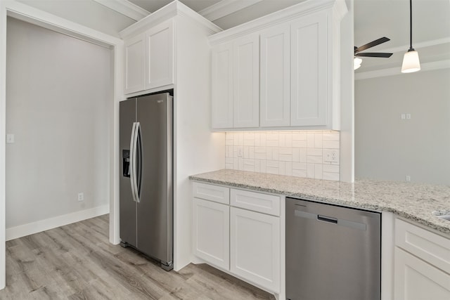 kitchen with ornamental molding, light hardwood / wood-style flooring, white cabinetry, and stainless steel appliances