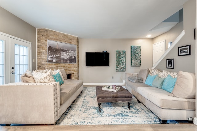 living room with french doors and brick wall