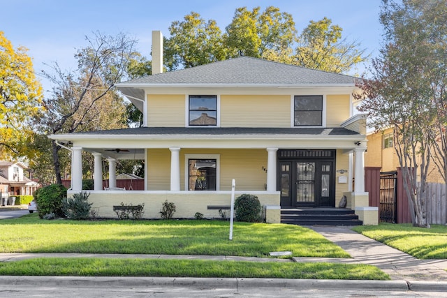 view of front of property featuring a front yard and covered porch