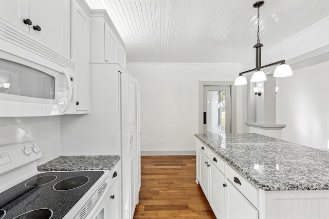 kitchen with light hardwood / wood-style flooring, white appliances, decorative light fixtures, backsplash, and white cabinets