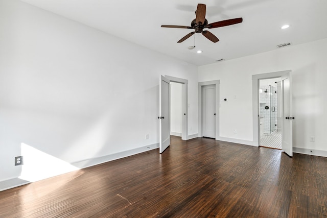 unfurnished bedroom featuring dark hardwood / wood-style floors and ceiling fan