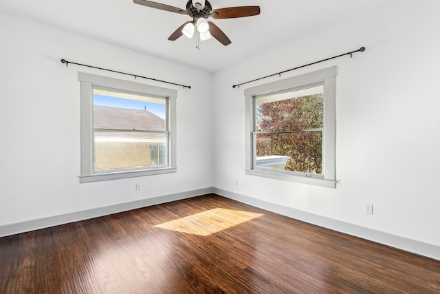 unfurnished room featuring dark hardwood / wood-style flooring, plenty of natural light, and ceiling fan