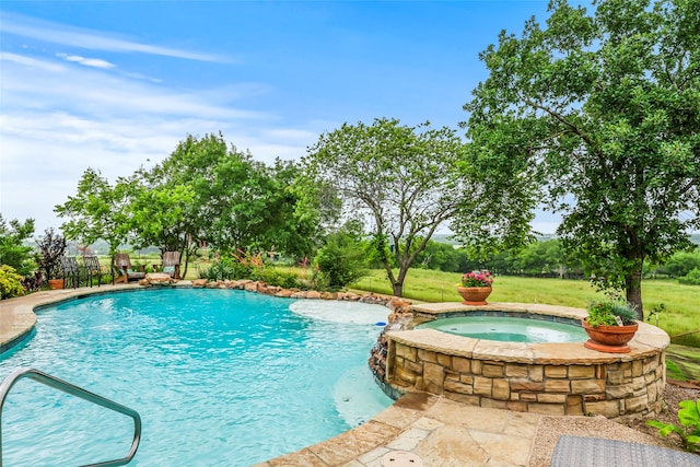 view of pool featuring a yard and an in ground hot tub