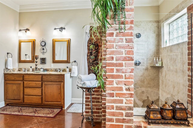 bathroom featuring tile patterned floors, vanity, a tile shower, and ornamental molding