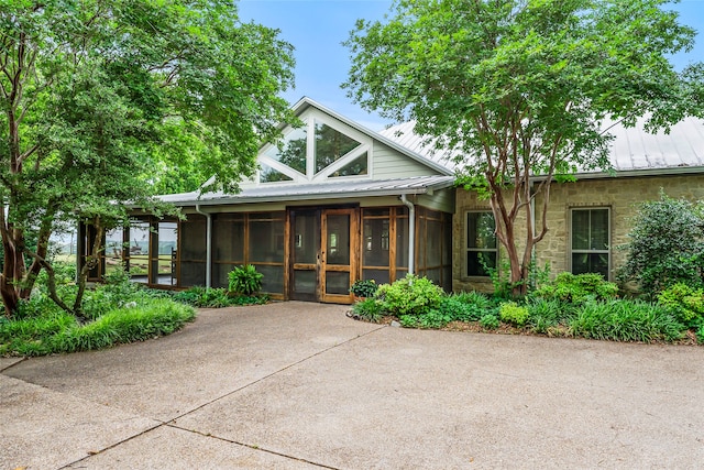 view of front facade featuring a sunroom