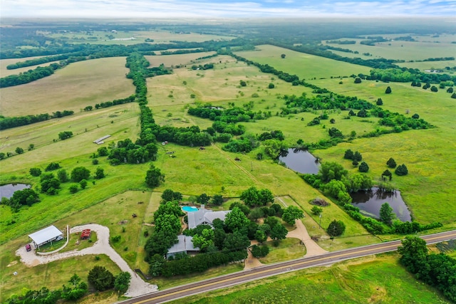 bird's eye view with a rural view and a water view