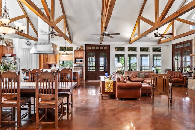 dining space with french doors, an inviting chandelier, and high vaulted ceiling