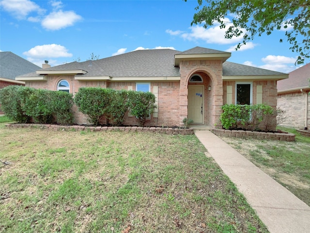 single story home featuring a front yard