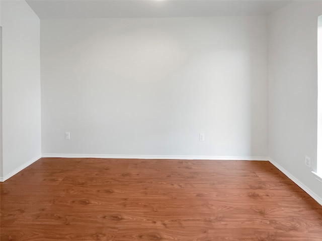 unfurnished room featuring hardwood / wood-style floors