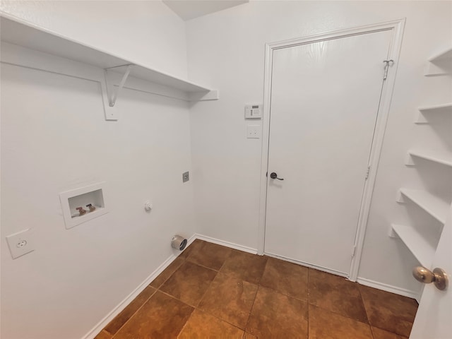 washroom featuring hookup for a washing machine, gas dryer hookup, hookup for an electric dryer, and dark tile floors