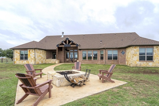 back of property featuring an outdoor fire pit and a lawn