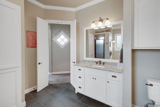 bathroom with crown molding, tile patterned floors, toilet, and vanity