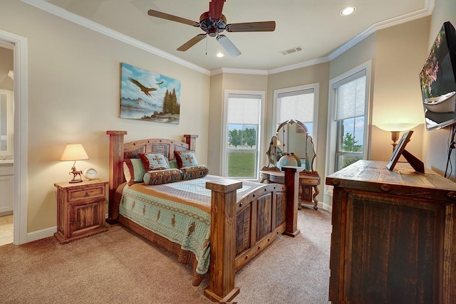 carpeted bedroom with ornamental molding and ceiling fan