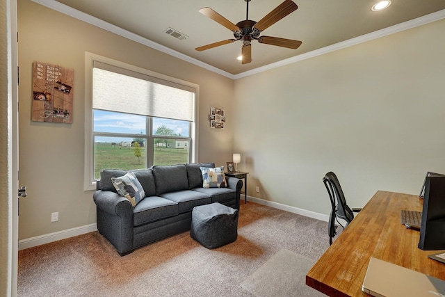 office space with crown molding, ceiling fan, and carpet floors