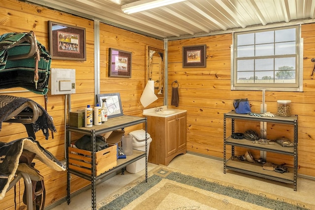 living area featuring wood walls