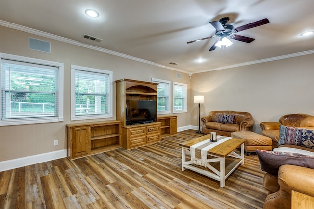 living room featuring ceiling fan, hardwood / wood-style flooring, and ornamental molding