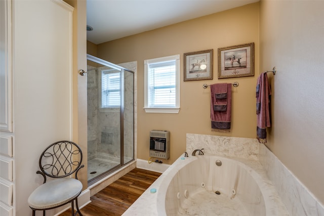 bathroom with shower with separate bathtub and hardwood / wood-style flooring