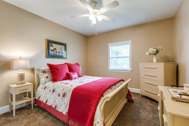 bedroom with ceiling fan and dark colored carpet