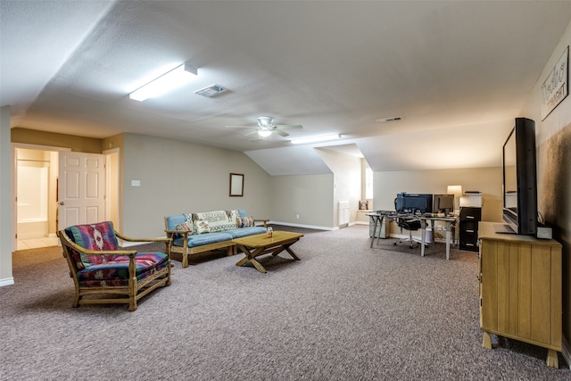 carpeted living room with vaulted ceiling, ceiling fan, and a textured ceiling