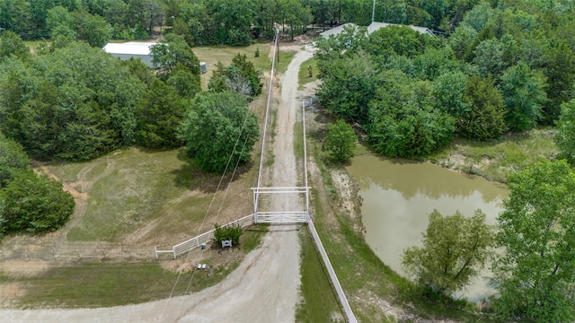 birds eye view of property featuring a water view