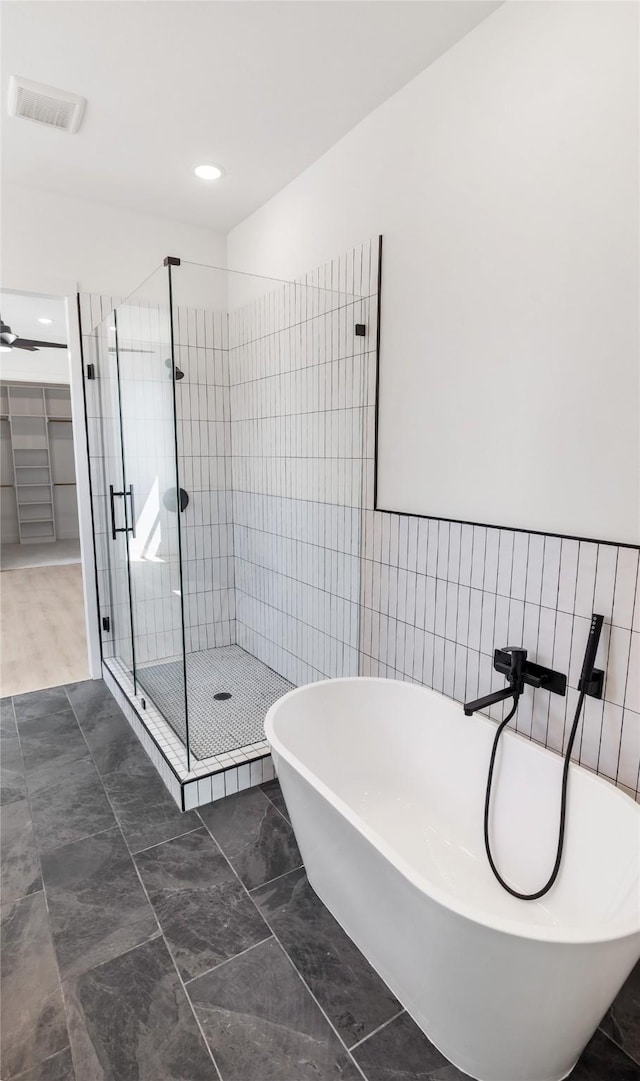 bathroom with plus walk in shower and tile patterned flooring