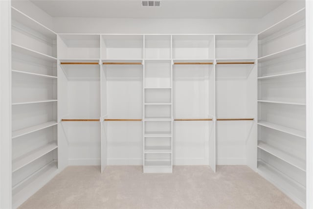 walk in closet featuring carpet