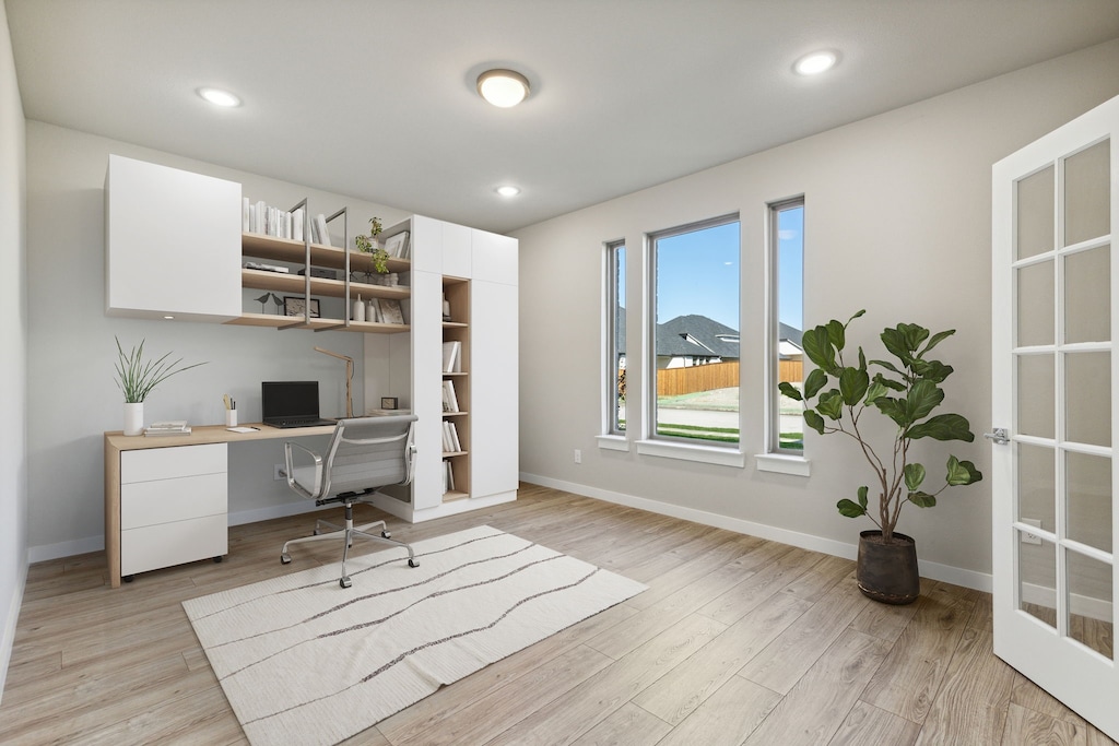 office with light hardwood / wood-style flooring