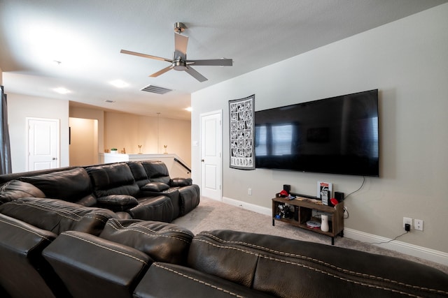 carpeted living room featuring ceiling fan, visible vents, and baseboards