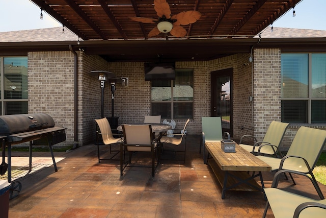 view of patio / terrace featuring outdoor dining area and a ceiling fan