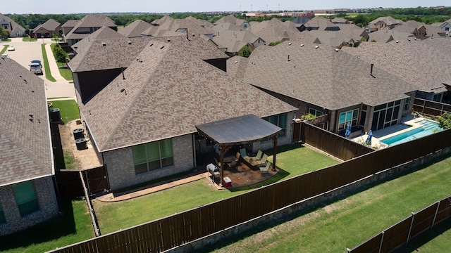 birds eye view of property with a residential view