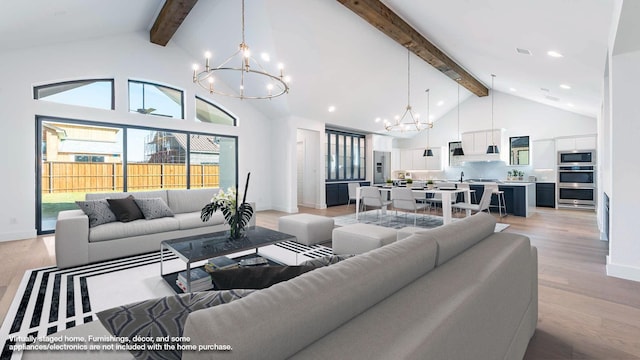 living room featuring light hardwood / wood-style flooring, high vaulted ceiling, beamed ceiling, and a chandelier