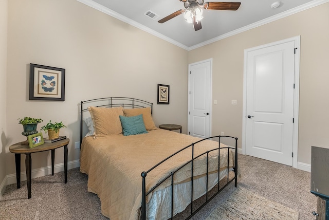 carpeted bedroom with ceiling fan and ornamental molding