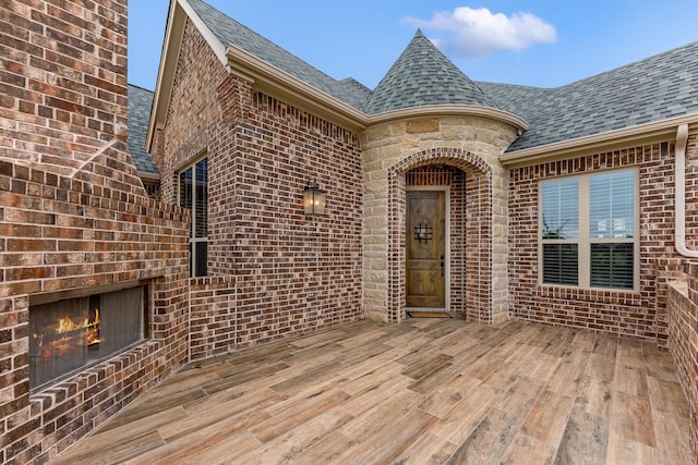 doorway to property featuring a wooden deck