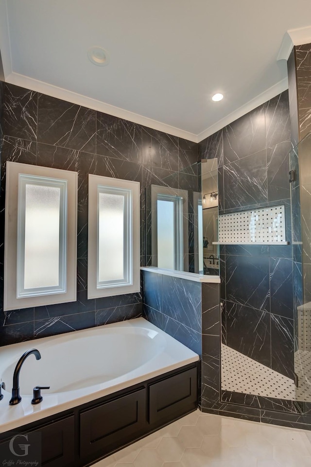 bathroom featuring ornamental molding, shower with separate bathtub, and tile walls