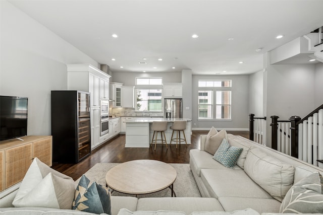 living room with dark hardwood / wood-style floors