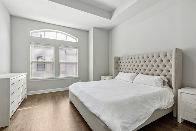 bedroom featuring dark hardwood / wood-style flooring