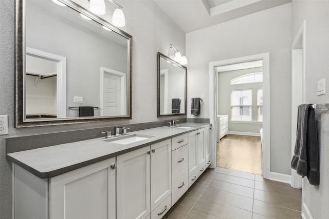 bathroom featuring dual sinks, hardwood / wood-style floors, and oversized vanity