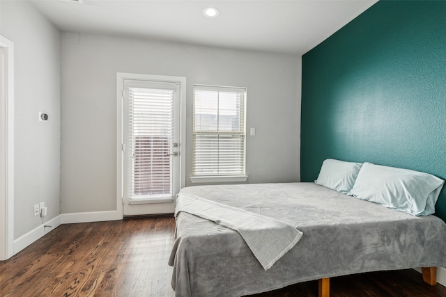 bedroom featuring dark wood-type flooring