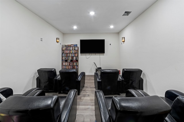 cinema room with wood-type flooring