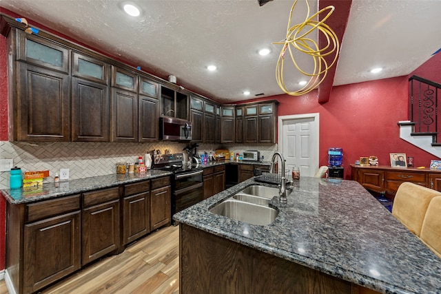 kitchen with dark brown cabinets, light hardwood / wood-style flooring, black electric range oven, backsplash, and sink