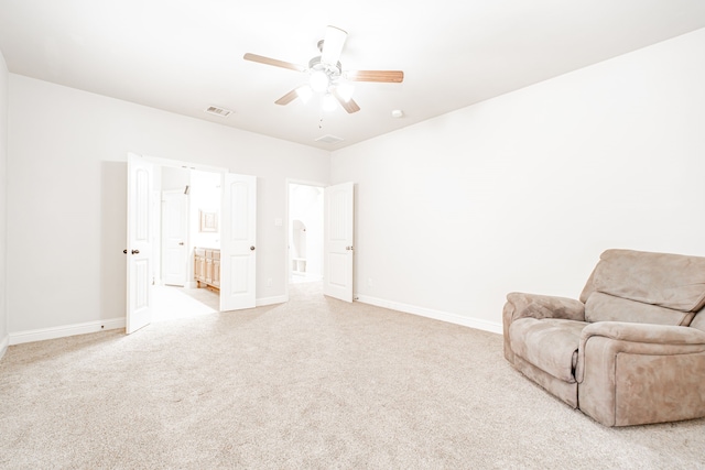 living area featuring ceiling fan