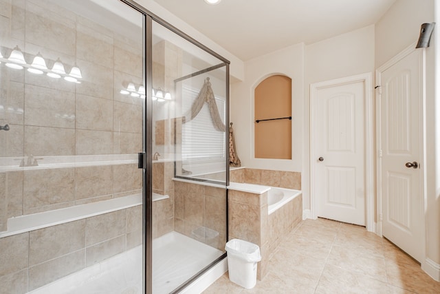 bathroom featuring tile floors and plus walk in shower