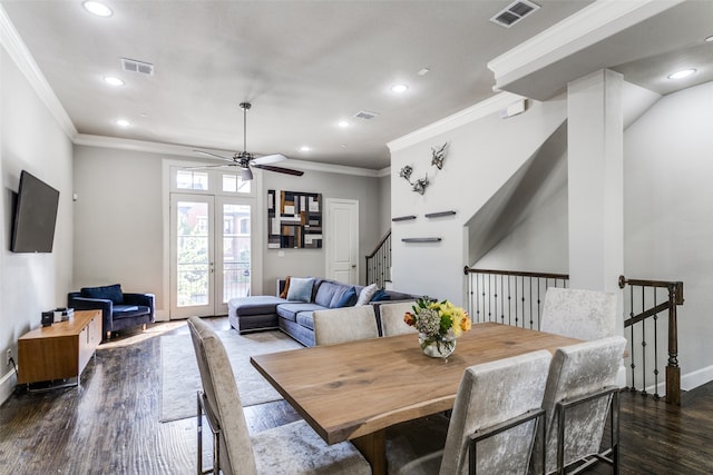 dining space featuring dark hardwood / wood-style flooring, ceiling fan, french doors, and crown molding