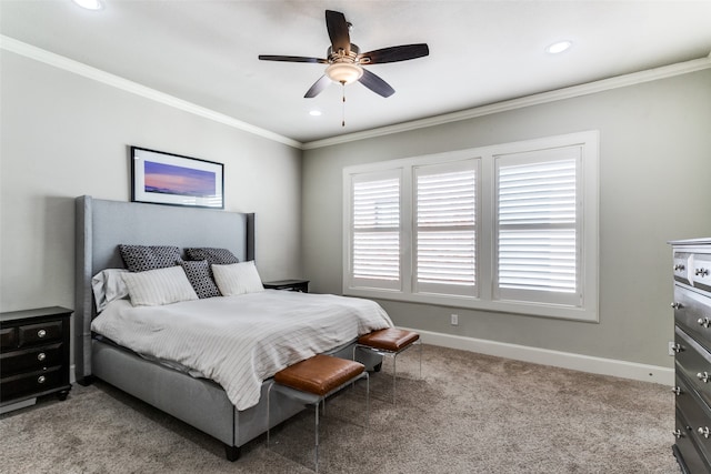 carpeted bedroom featuring ceiling fan and crown molding