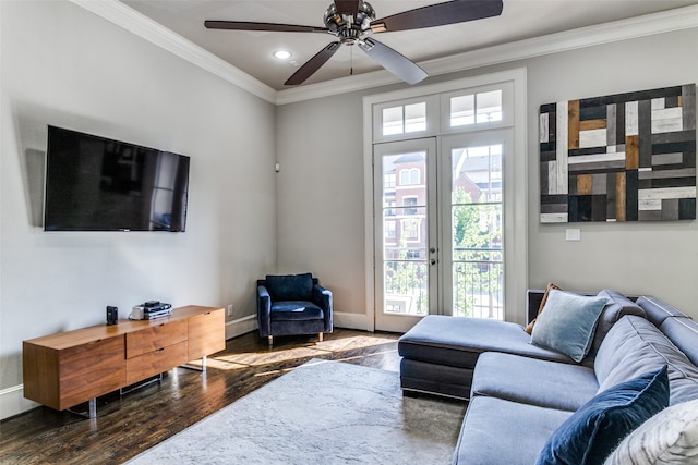 living room with crown molding, hardwood / wood-style flooring, ceiling fan, and french doors