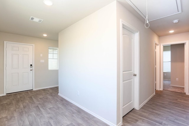 hallway with light wood-type flooring