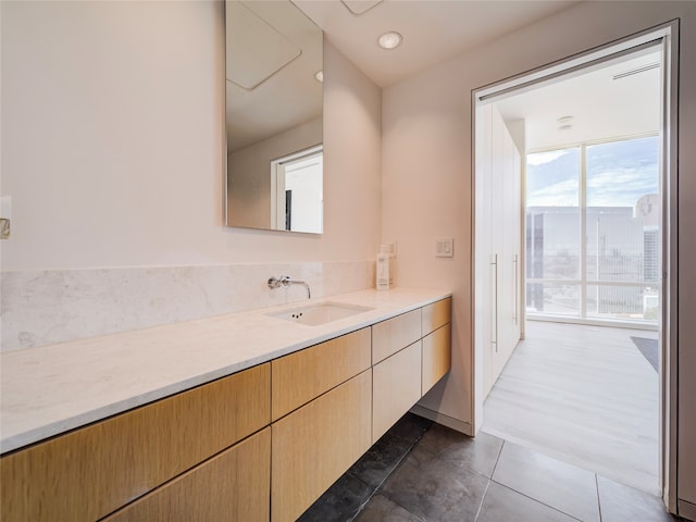 bathroom featuring tile patterned flooring and vanity